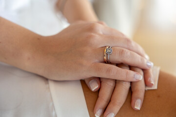Elegant Bridal Hands with Engagement and Wedding Rings
