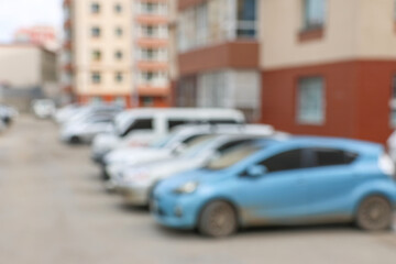 Blur outdoor car park in the official place and the hot sun. Cars parked in a row. blur and abstract background