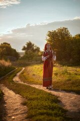 A photo of a girl in folk clothes.