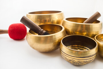 Brass Singing Bowls. A set of golden Tibetan singing bowls with mallets