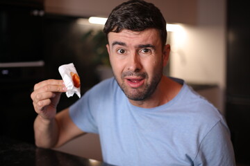 Terrified man spitting some blood 