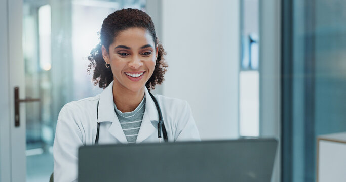 Happy woman, doctor and typing with laptop for healthcare, good news or telehealth at hospital. Female person or medical employee with smile on computer for online research or communication at clinic - Powered by Adobe