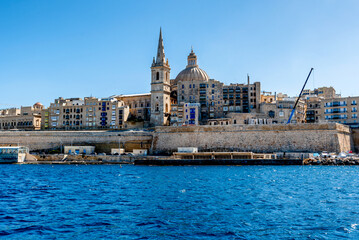 Fototapeta premium Beautiful cityscape with ancient architecture of the Valletta city in Malta. View from the sea