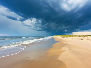 Obraz premium Beach with dark storm clouds gathering on the horizon