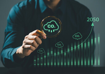 Concept of climate change problem, global warming and carbon dioxide emissions, young man holding...