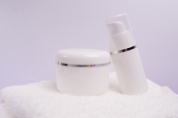 Container for cream, shampoo, toiletries, spa. Unbranded white plastic bottles. Bottle with a dispenser for cosmetic products. Skin care and beauty concept. Mockup style, copy space 