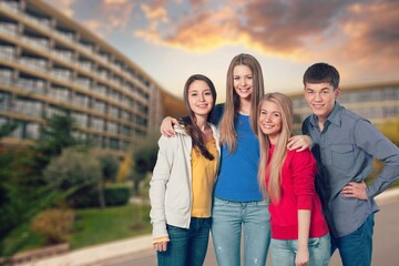 Happy young students friends in campus