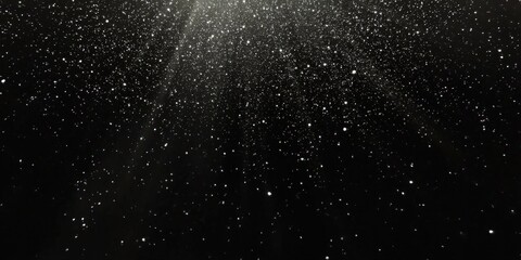 small white particles on  Black background , Small white dust particles floating  in air