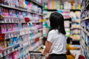 Portrait of a Woman shopping in the supermarket.
