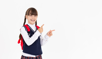 Image of european primary school student on white background pointing right