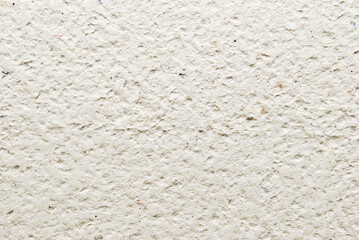 A sheet of gray porous recycled cardboard texture as background