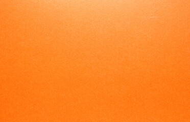 Glossy orange cardboard texture as background