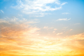 Obraz premium Beautiful , luxury soft gradient orange gold clouds and sunlight on the blue sky perfect for the background, take in everning,Twilight, Large size, high definition landscape photo