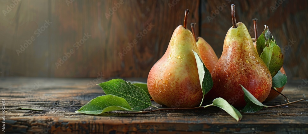 Poster Pears with leaves arranged on a wooden table with copy space image