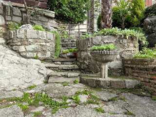 Gray antique stone brick wall in city Hum, Croatia