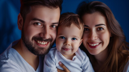 Fototapeta premium happy family of mom dad and son on a dark blue background