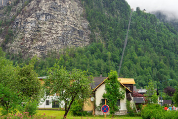 Hallstatt, Austria. Mountain village in the Austrian Alps in fog. Funicular in the mountains