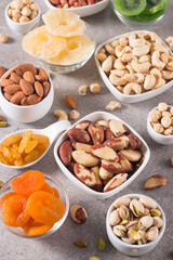 Healthy mix nuts on wooden background. Almonds, hazelnuts, cashews, peanuts, pistachios, Brazil nuts