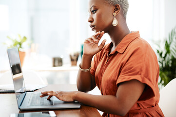 Typing, online and black woman with laptop, writer and thinking for ideas in office and...