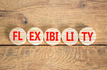 Flexibility symbol. Concept word Flexibility on beautiful wooden circles. Beautiful wooden...