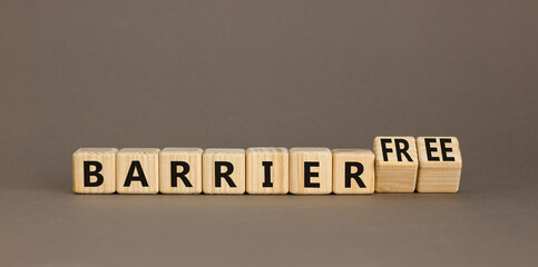Barrier free symbol. Concept words Barrier free on beautiful wooden cubes. Beautiful grey table...