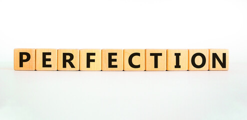 Perfection symbol. Concept word Perfection on beautiful wooden blocks. Beautiful white background. Business perfection concept. Copy space.