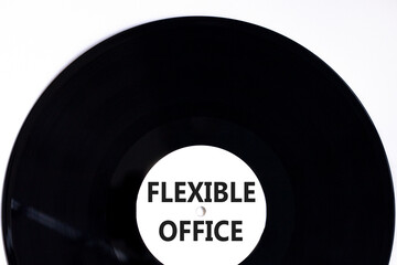 Flexible office symbol. Concept words Flexible office on beautiful white black vinyl disk. Beautiful white paper background. Business Flexible office concept. Copy space.