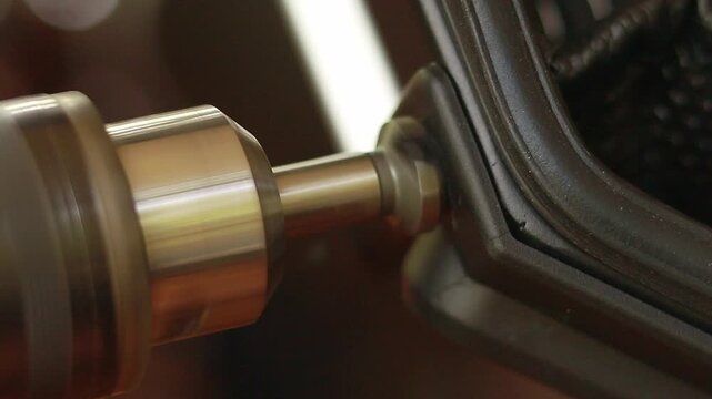 Close up to a countersink drill bit used in drilling a hole in a hard plastic case