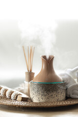 Essential oil aroma diffuser humidifier diffusing water articles in the air.