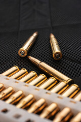 Cartridges for rifle and carbine on a black. Bullet  on black background. Rifle bullets close-up on...