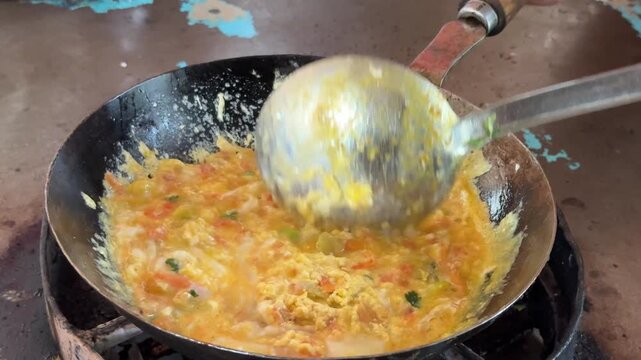 Egg and Tomato frying South Asian food. Anda Tamatar making in Dhaba.