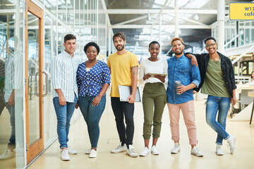 Business people, group and portrait in creative workspace with technology, collaboration and web design. Designer team, digital devices and employees with pride, cooperation and workplace community