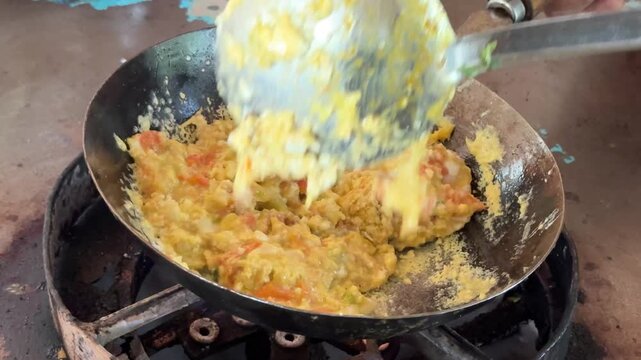 Egg and Tomato frying South Asian food. Anda Tamatar making in Dhaba.