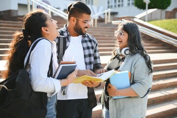 Cheerful Indian asian young group of college students or friends together