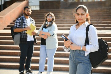 Cheerful Indian asian young group of college students or friends together