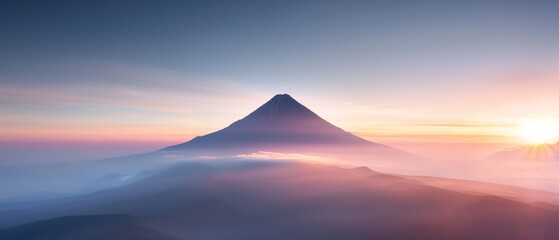 Fototapeta premium A breathtaking mountain landscape at sunrise, showcasing vibrant hues and misty valleys, perfect for nature and travel themes.