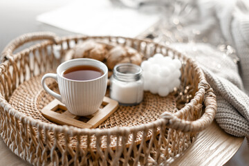 Home coziness composition with a cup of tea. Autumn home comfort.