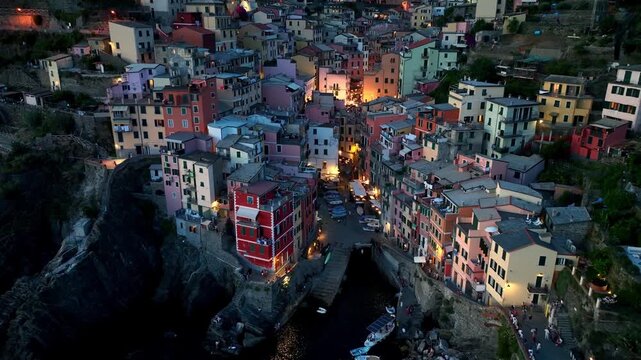 Cinque terre night aerial view, flying in Riomaggiore in the evening, vacation in Liguria, Italy, Italian holiday in cinque terre