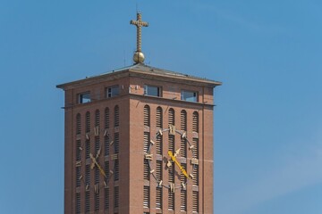 City of Aparecida do Norte, Brazil. Clock tower close up. Cathedral Basilica of the National Sanctuary of Our Lady of Aparecida on a sunny day.