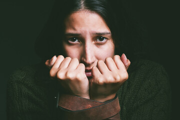 Kidnap, woman and victim with hostage portrait in studio with fear, scared and domestic violence...