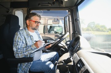 handsome man working in towing service and driving his truck