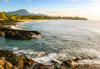 Sunrise on The Rocky Volcanic Shoreline of Shipwreck Beach with Ha'upu Ridge In The Distance, Poipu, Kauai, USA