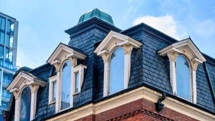 Colonial heritage building, detail of windows on the rooftop, Toronto, Canada