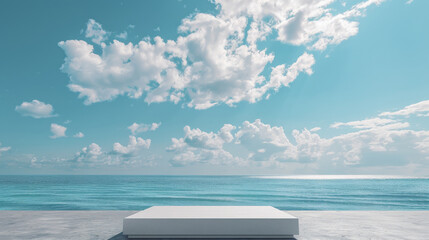 A sleek, minimalist podium designed for product display, placed on a beach. The sky above is a bright blue with scattered white clouds, enhancing the tranquil and sunny atmosphere.