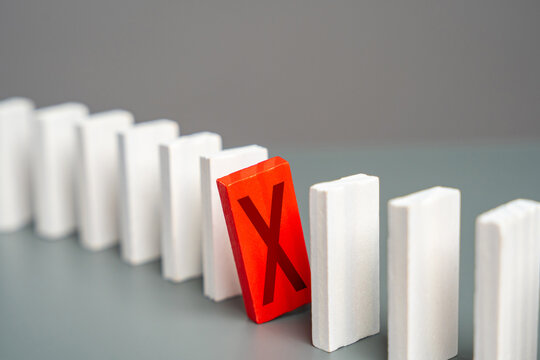 The red domino with a cross hinders the whole process. Breakdown. Out of service. Sanctions. Stop work. Refusal and protest. Critical error. Unavailability. Unfulfilled plans. Negative review