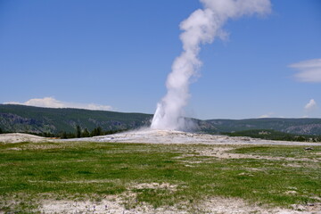 Old Faithful Geyser erupt, landscape in Yellowstone National Park in Wyoming, United States