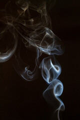 The artwork created from smoke is beautiful and gentle. Taken with a camera that has a high magnification rate.