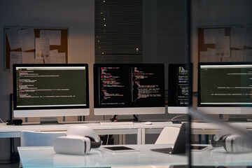 Naklejka premium Background image of three computer screens with code lines cybersecurity office, copy space