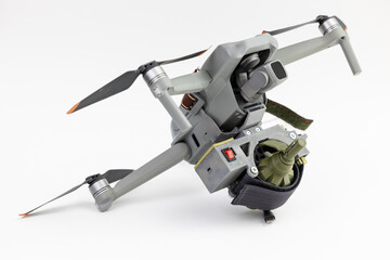 Army drone with mechanism for dropping grenades on white isolated background. Concept military UAVs using in weapon, Engineering development for war