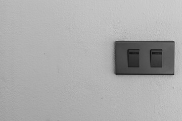 Beautiful clean white wall inside the room with a dark light power switch, Saving energy and save world concept.